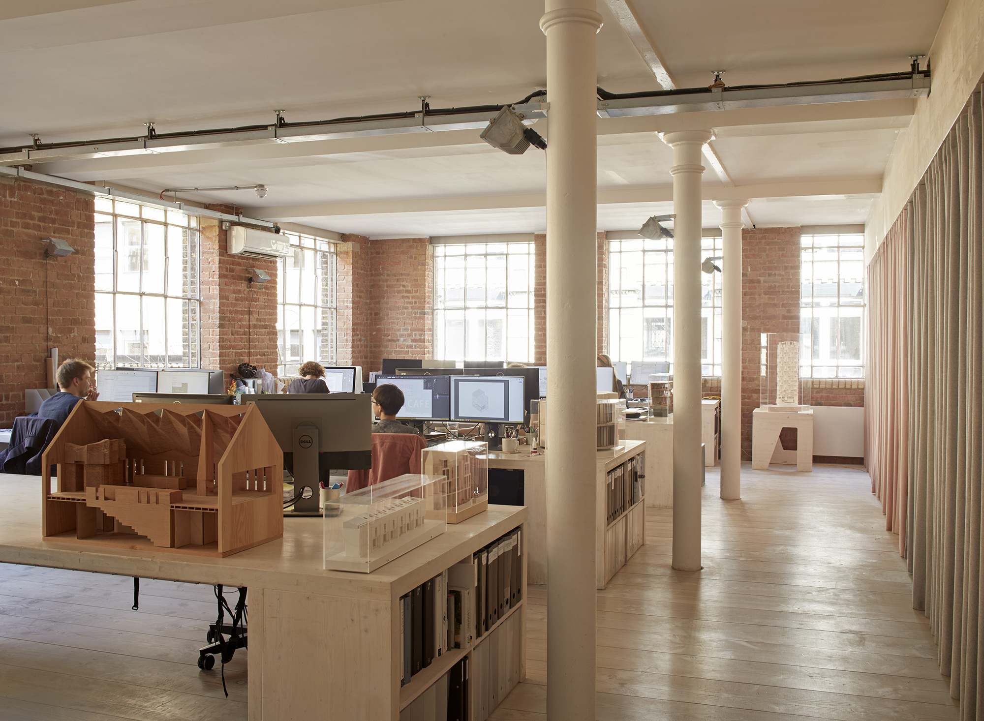 Desk spaces in bright architectural practice Desk spaces in bright architectural practice