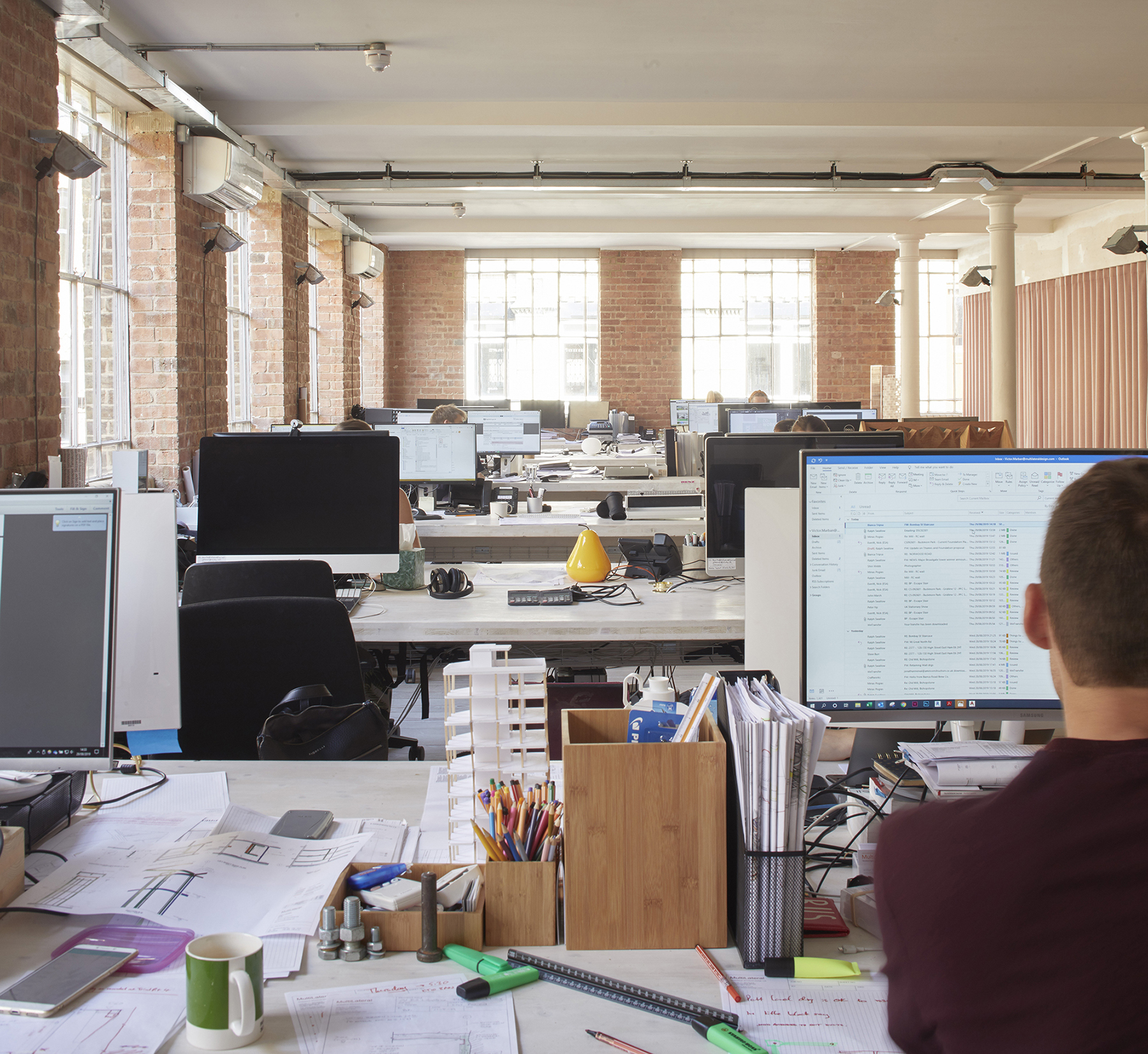 Desk spaces in bright architectural practice Desk spaces in bright architectural practice