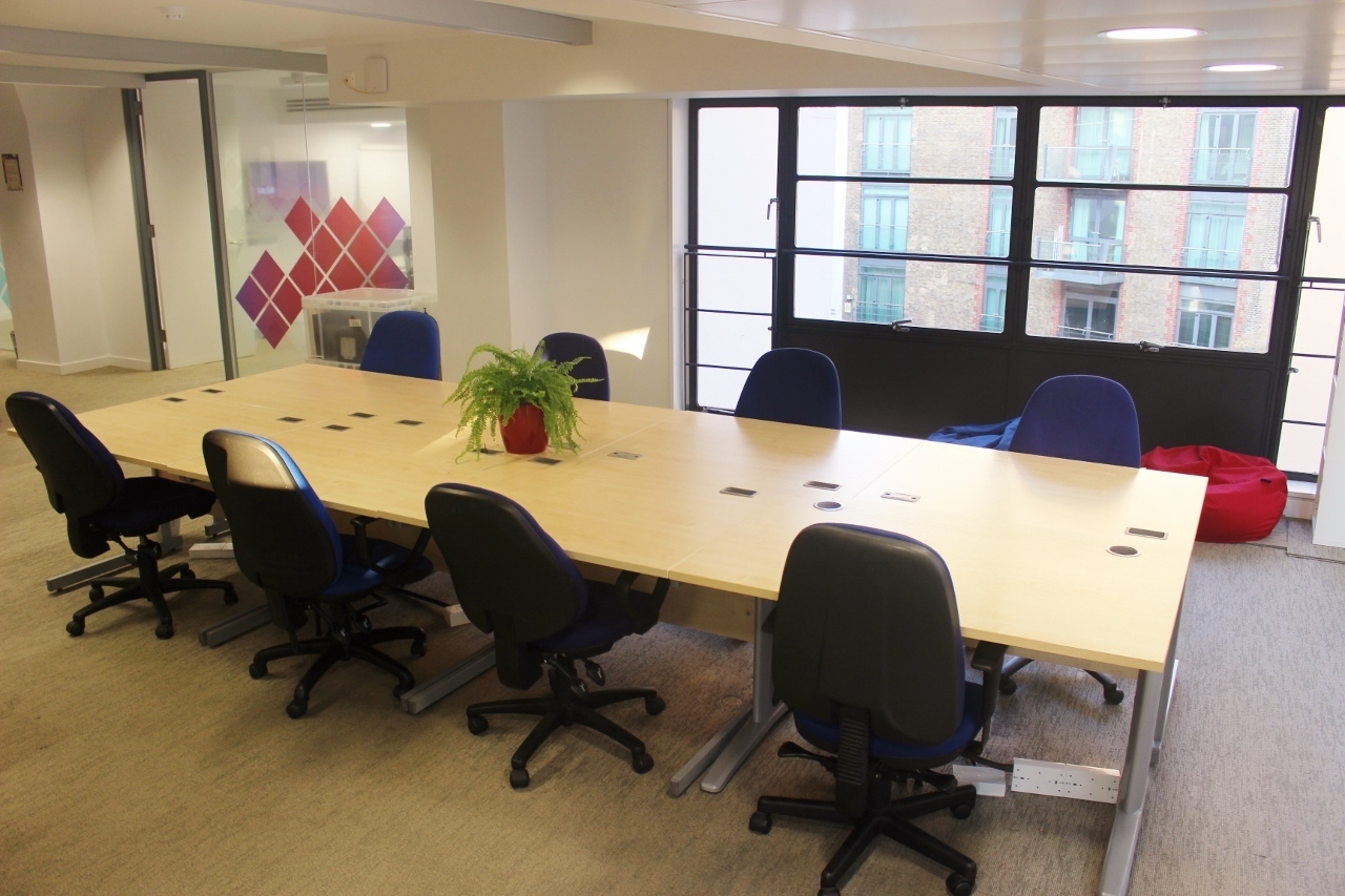 Bright deskspace in freindly office by the river