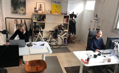 Sit/stand desk in 4-person shared workspace Sit/stand desk in 4-person shared workspace