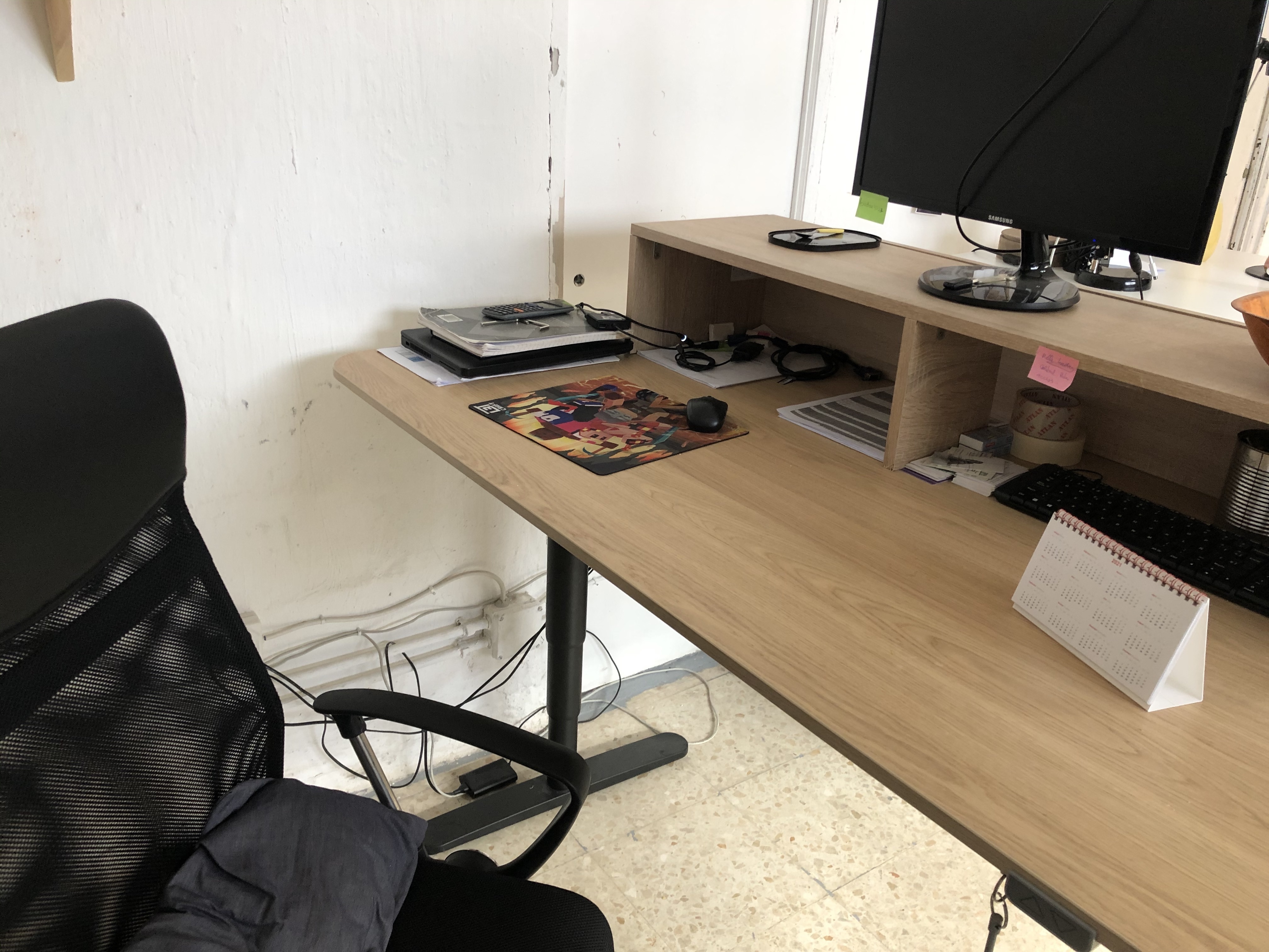 Sit/stand desk in 4-person shared workspace