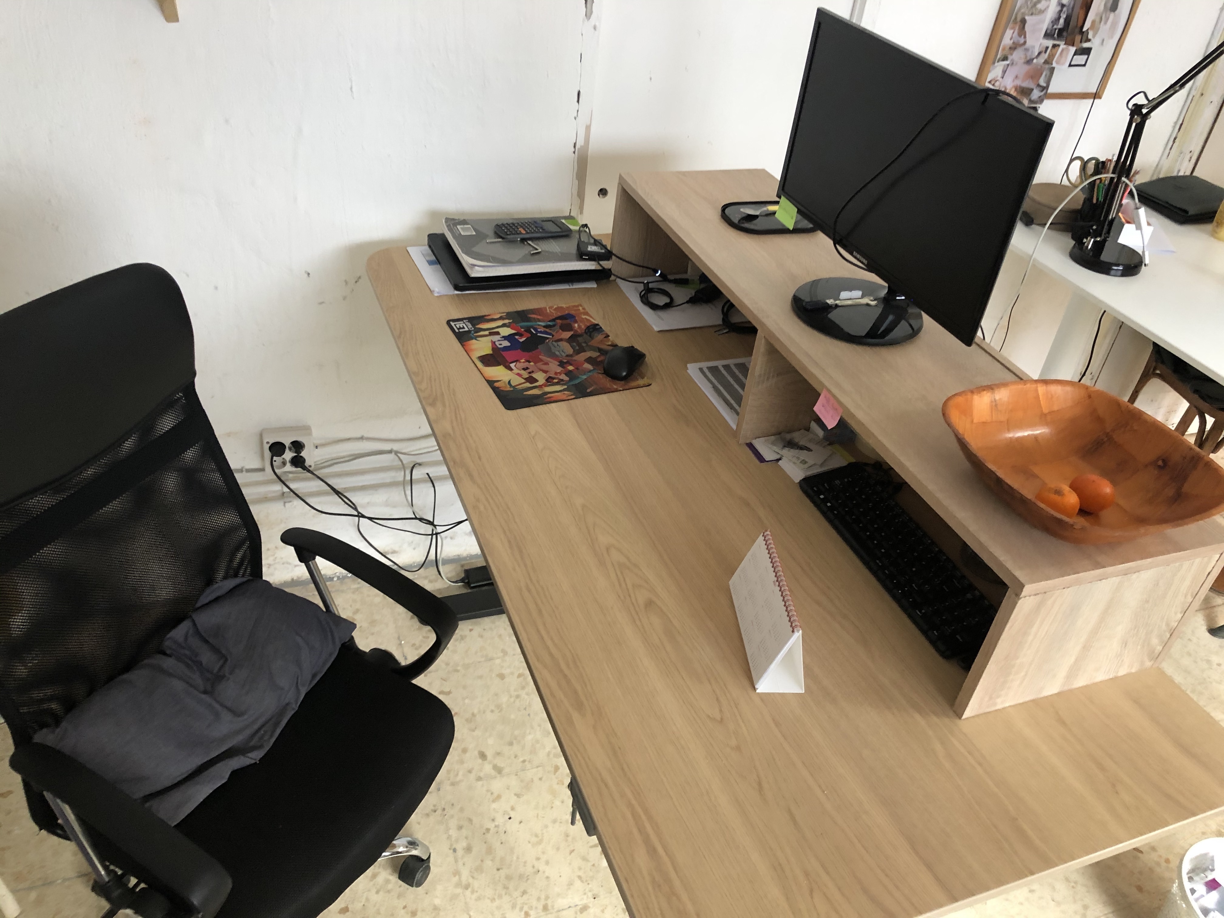 Sit/stand desk in 4-person shared workspace