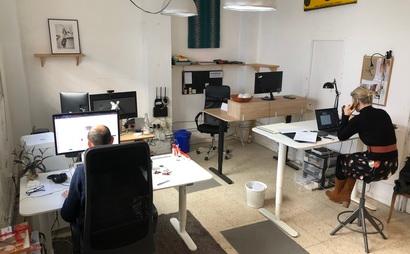 Sit/stand desk in 4-person shared workspace Sit/stand desk in 4-person shared workspace