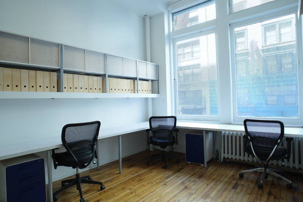 Private Office 2 with large windows (easily accommodates 3-4 people) 
