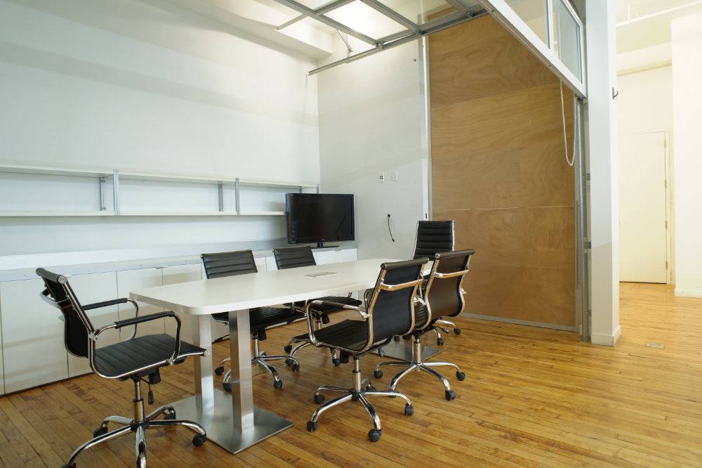 Private Office 2 with large windows (easily accommodates 3-4 people) 