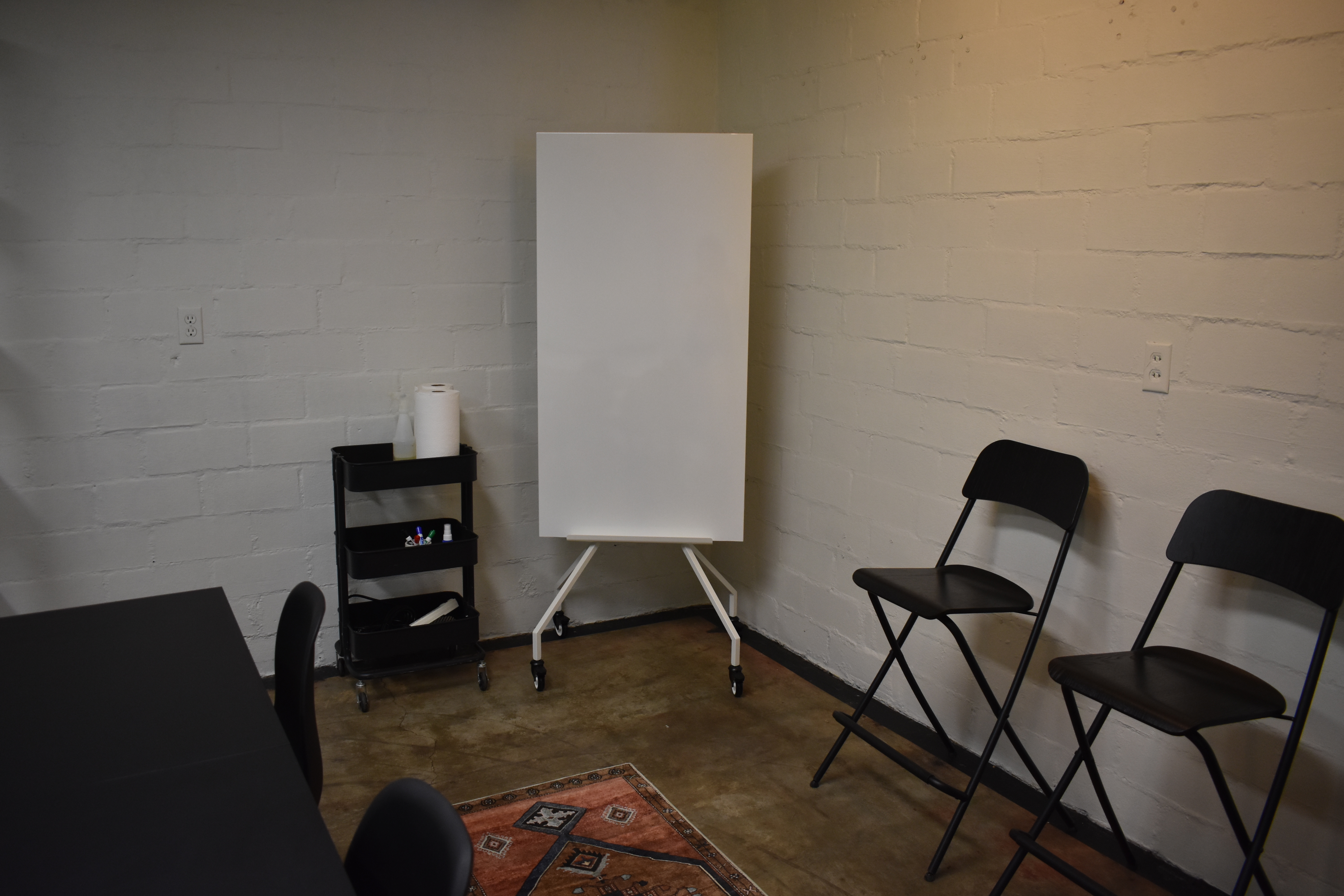 Cozy meeting space with modern touches and free on-site parking.