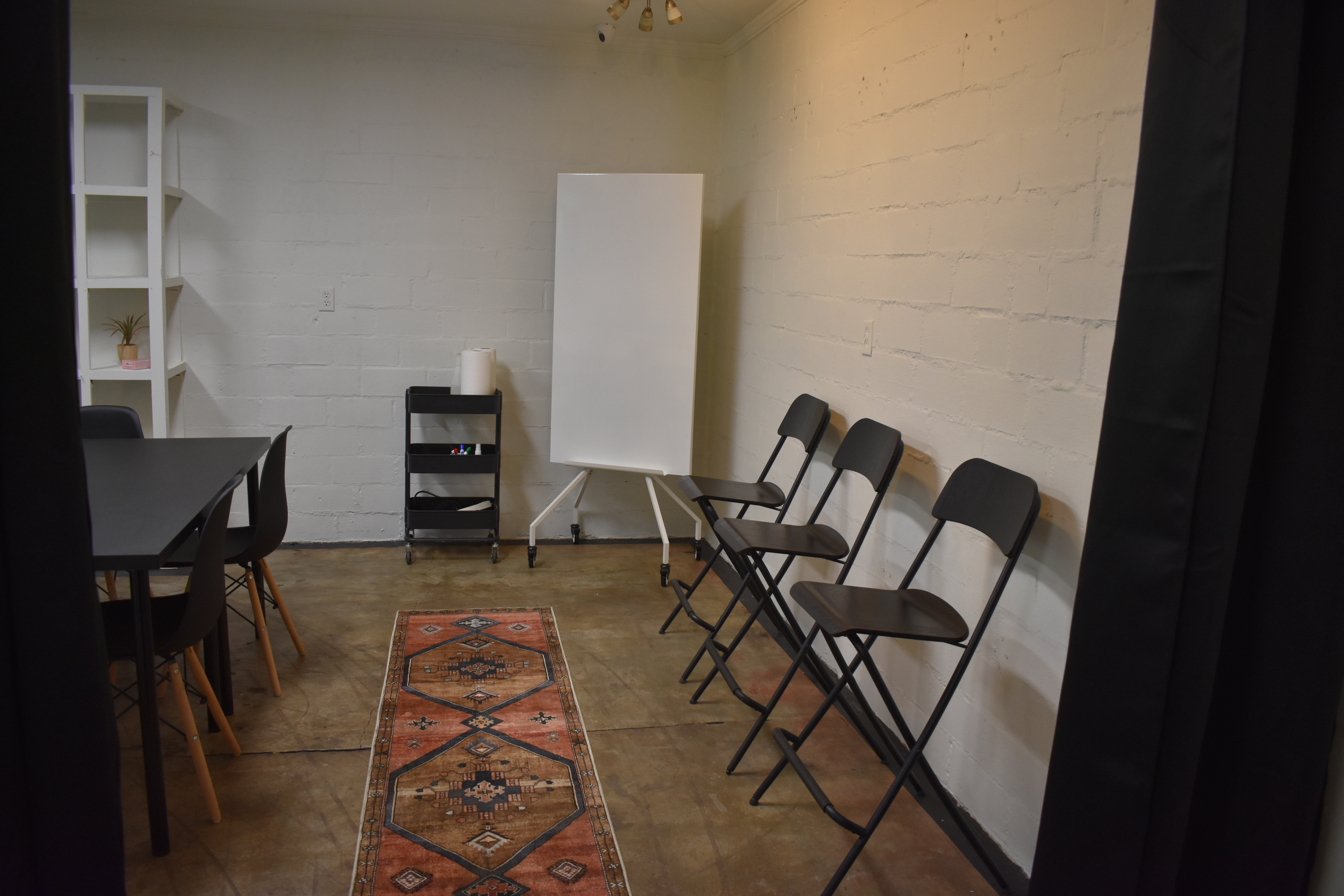 Cozy meeting space with modern touches and free on-site parking.