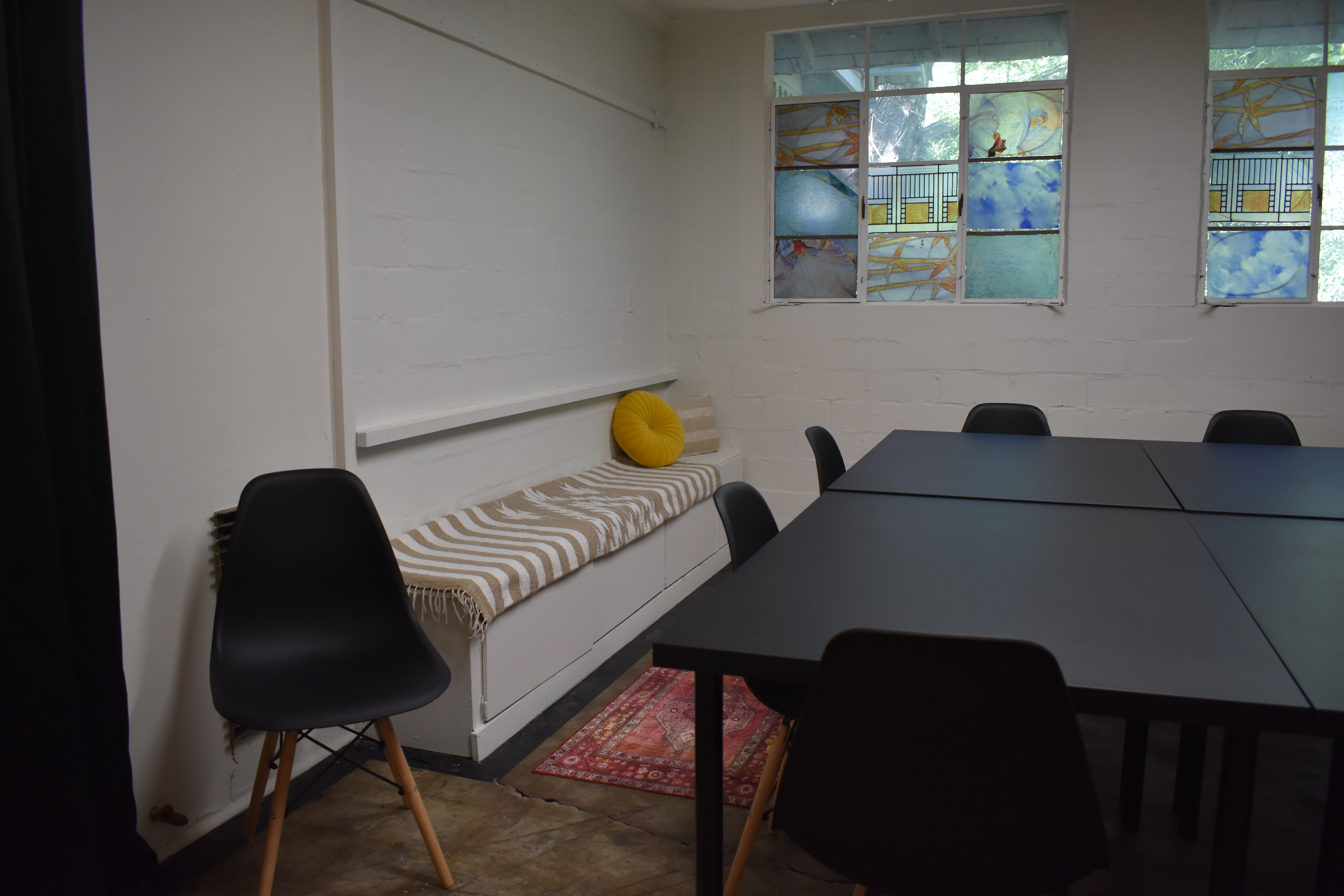 Cozy meeting space with modern touches and free on-site parking.