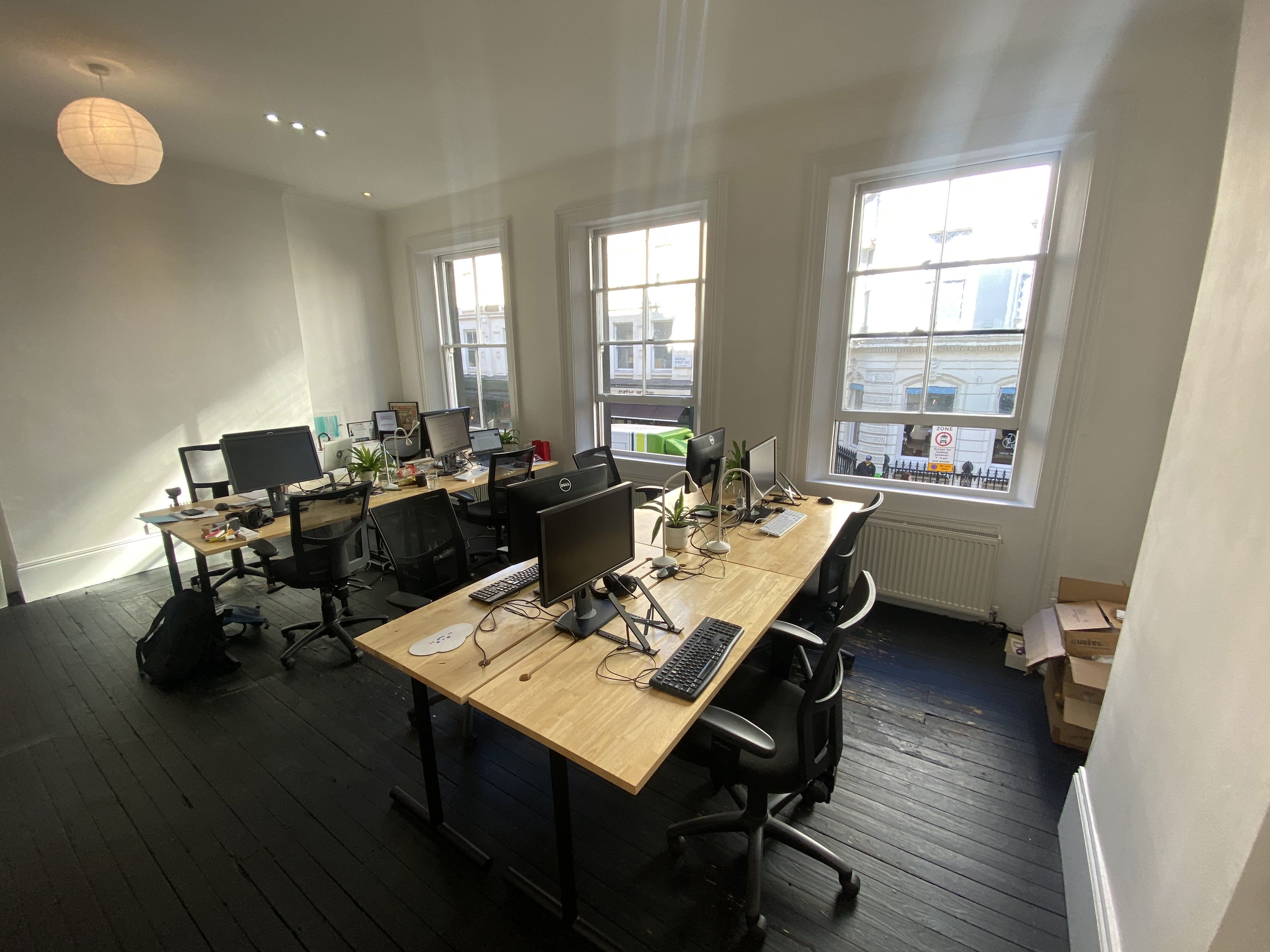 Four desks in shared office with small B-Corp. 