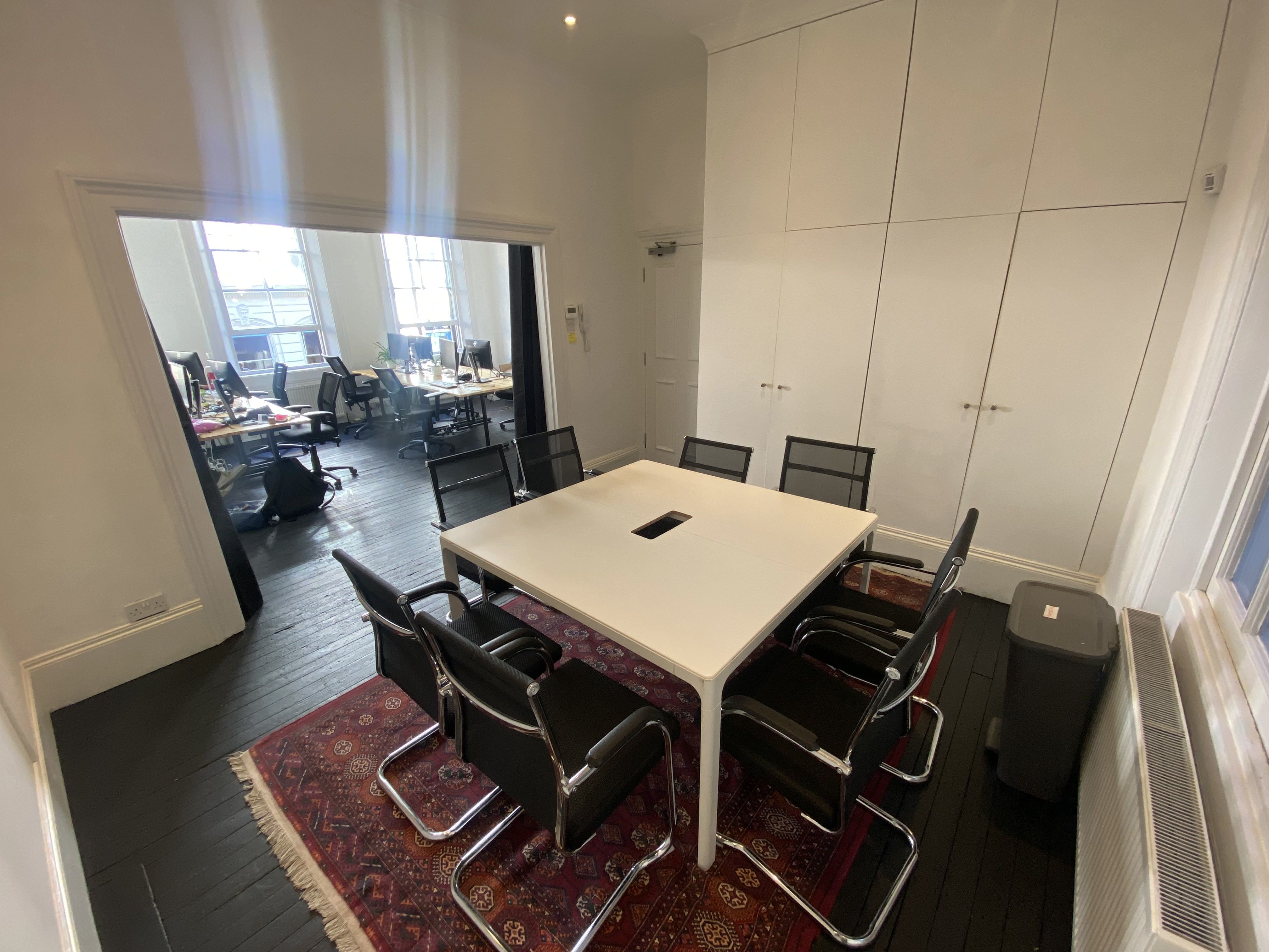 Four desks in shared office with small B-Corp. 