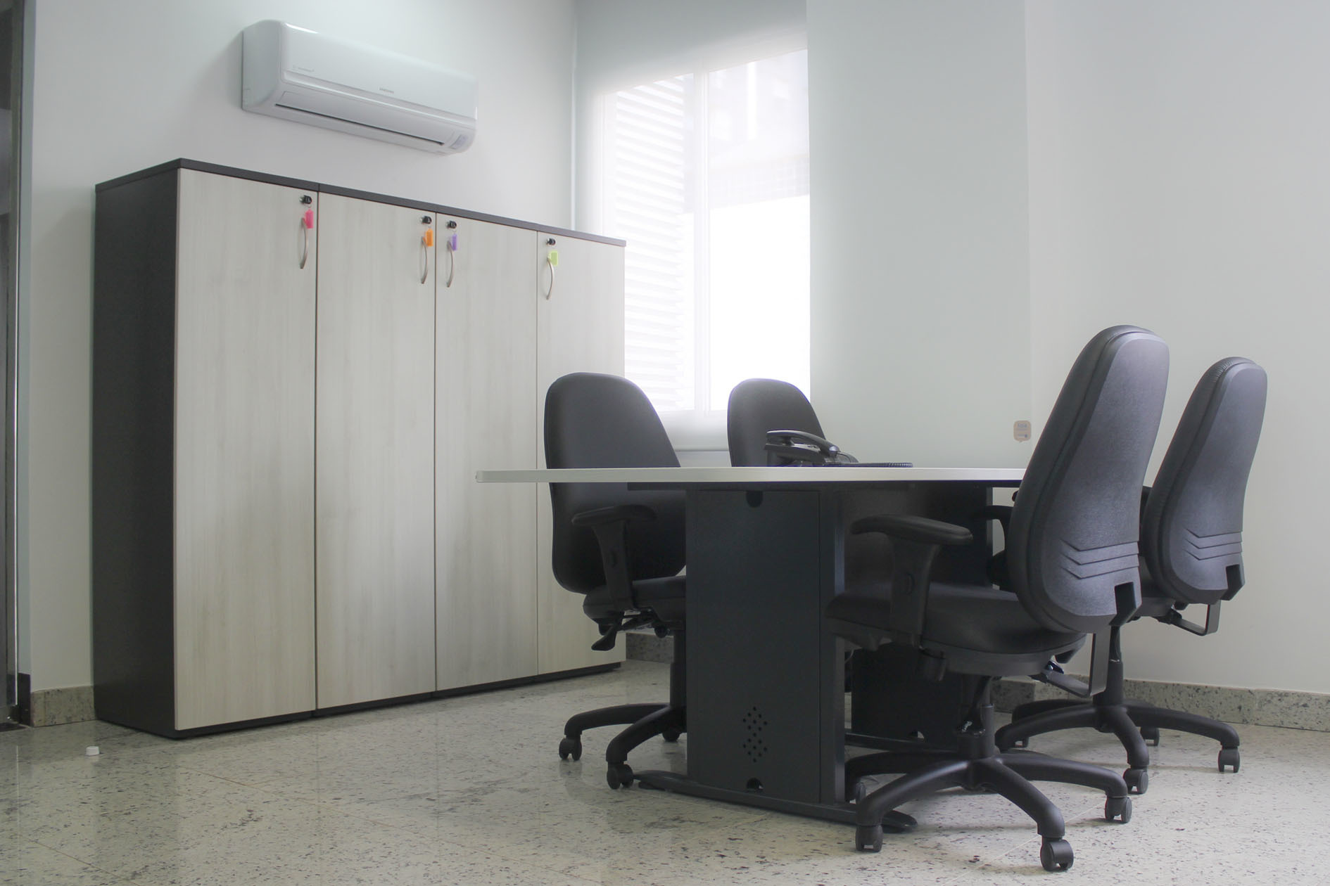 Work stations with private desks, meeting room