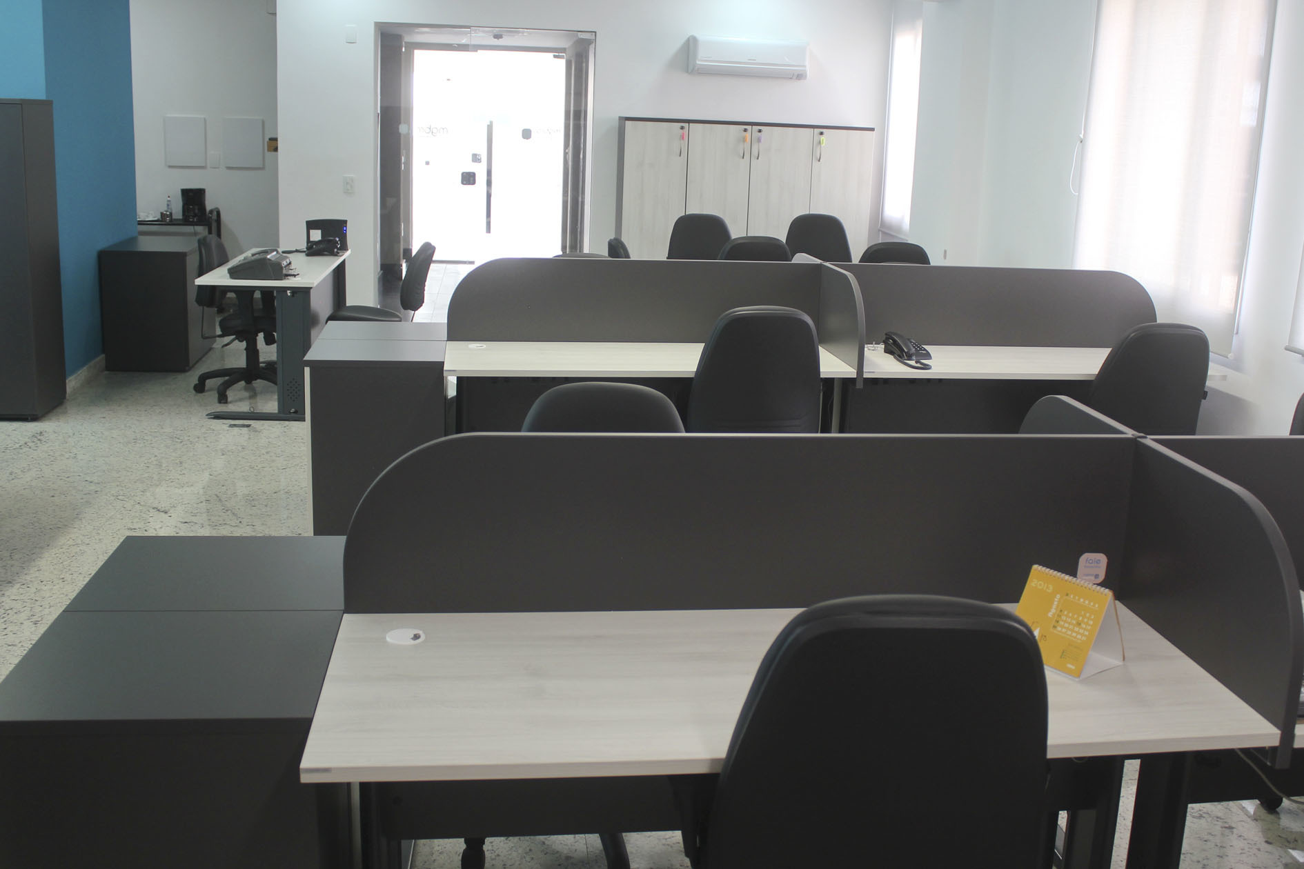 Work stations with private desks, meeting room