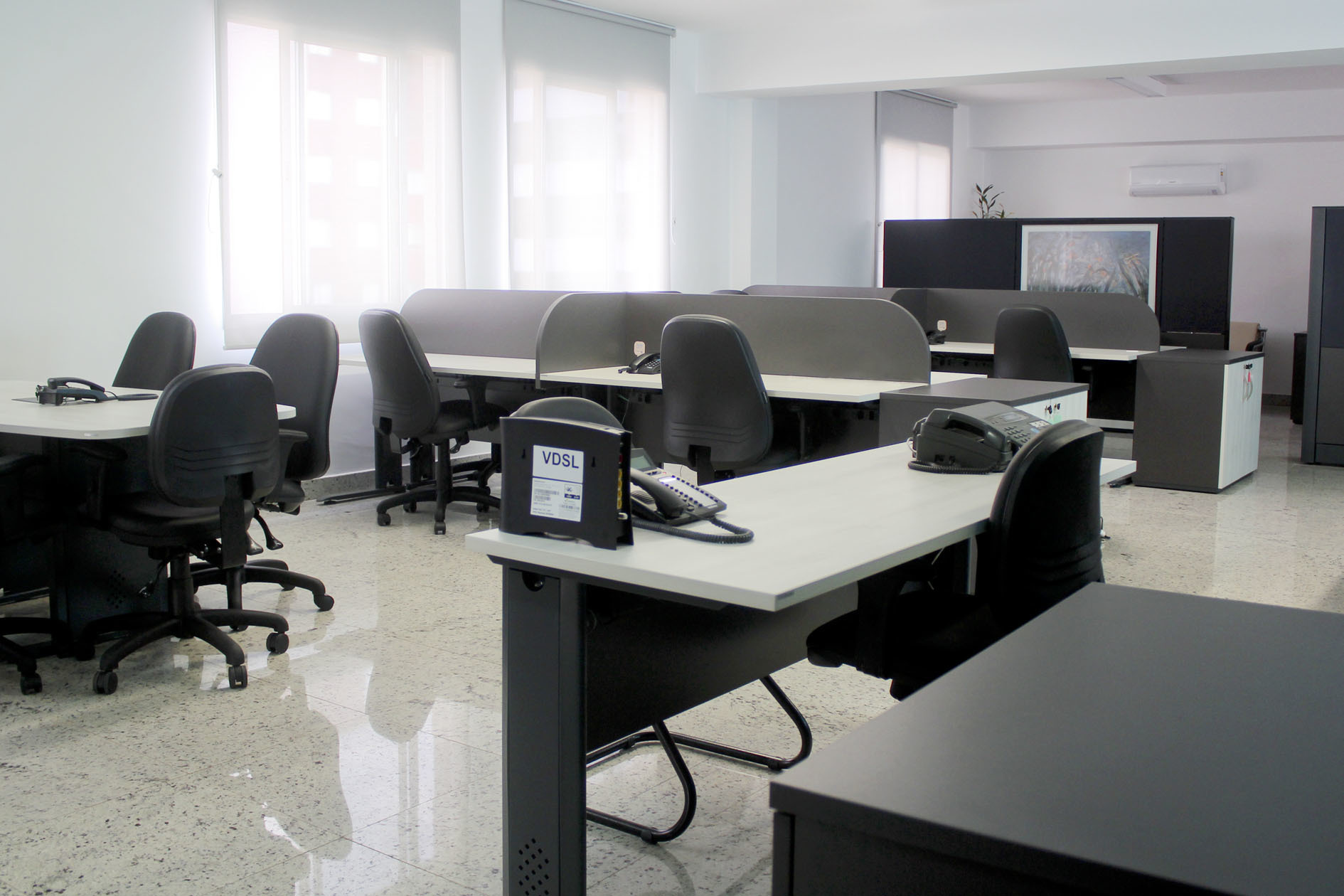 Work stations with private desks, meeting room