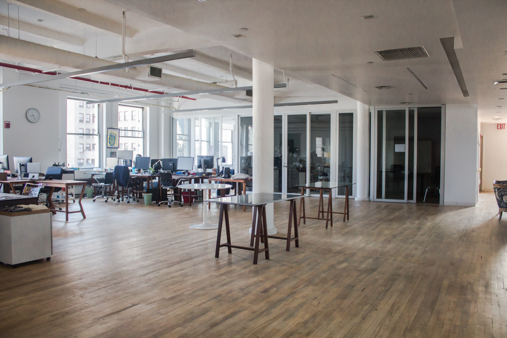 Individual desks in a spacious and bright communal loft Individual desks in a spacious and bright communal loft