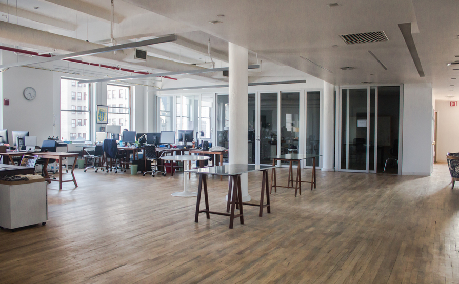 Individual desks in a spacious and bright communal loft Individual desks in a spacious and bright communal loft