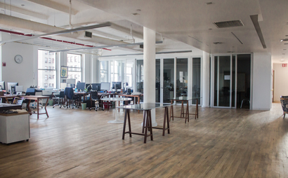Individual desks in a spacious and bright communal loft Individual desks in a spacious and bright communal loft