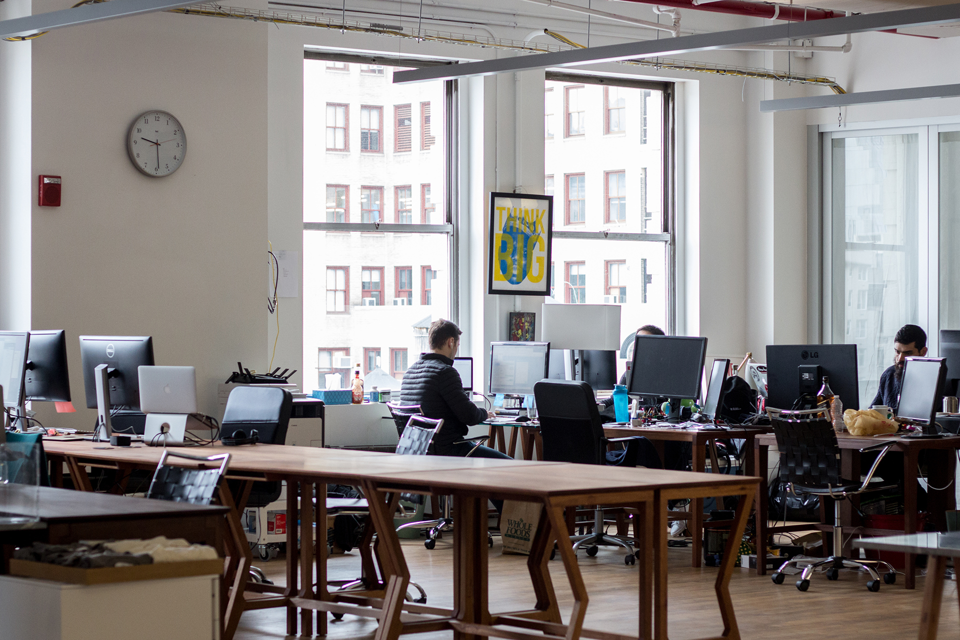 Individual desks in a spacious and bright communal loft Individual desks in a spacious and bright communal loft
