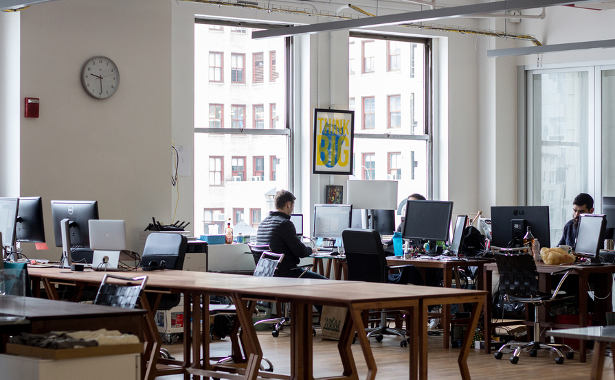 Individual desks in a spacious and bright communal loft Individual desks in a spacious and bright communal loft