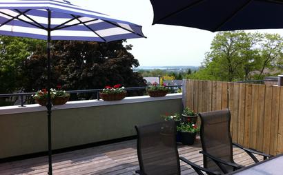 Dedicated desks. Shared office space. Big windows. Open concept. Decks with a view of the lake.