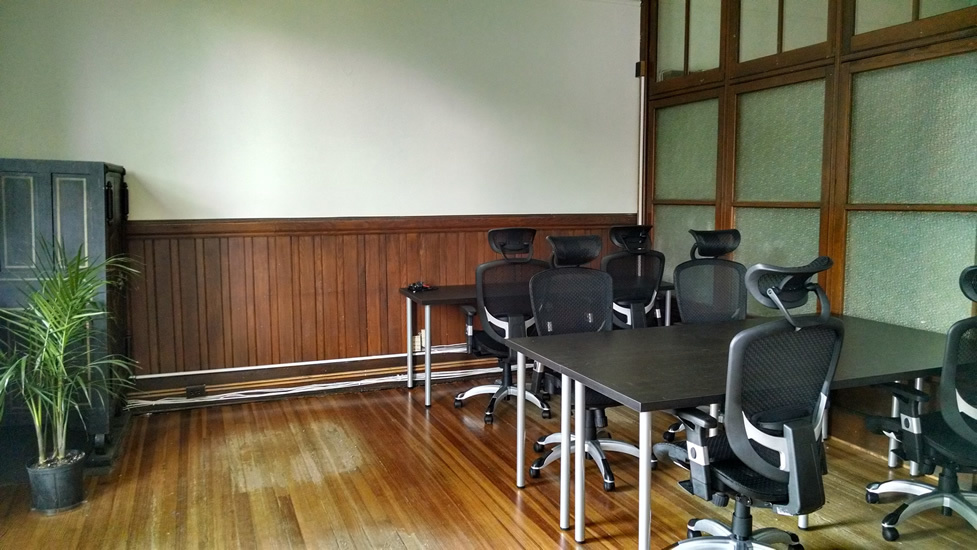 Open desks and tables in coworking space