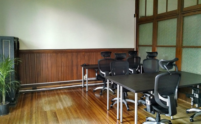 Open desks and tables in coworking space Open desks and tables in coworking space