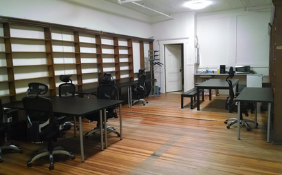 Open desks and tables in coworking space Open desks and tables in coworking space