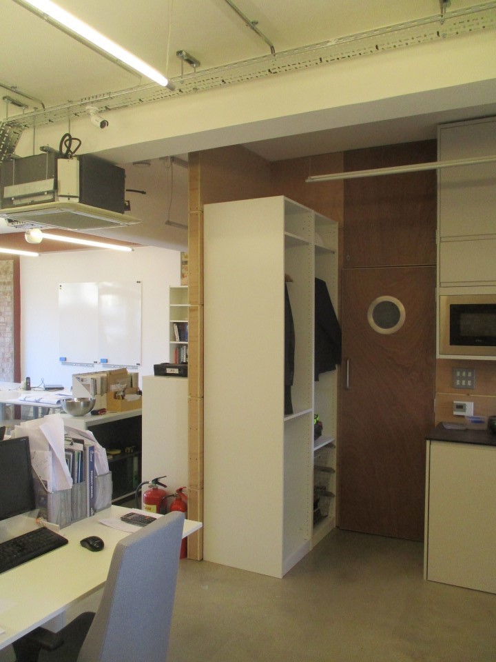 Comfortable desk, chair and cabinet in shared secure studio work space  