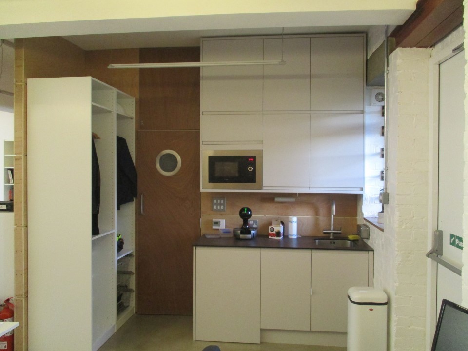 Comfortable desk, chair and cabinet in shared secure studio work space  