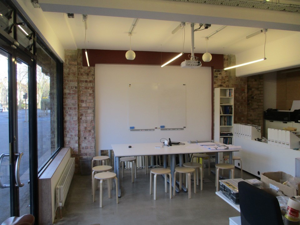 Comfortable desk, chair and cabinet in shared secure studio work space  