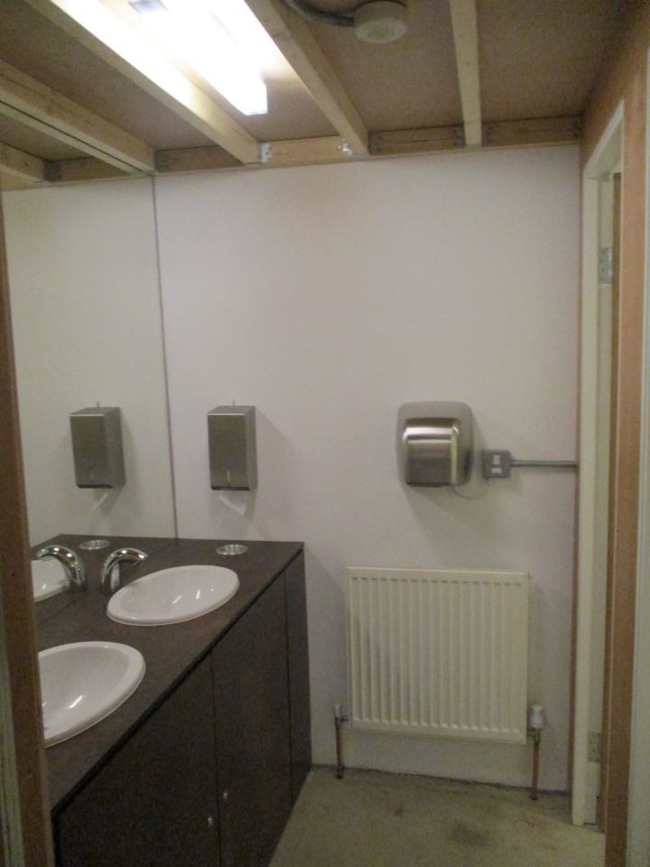 Comfortable desk, chair and cabinet in shared secure studio work space  