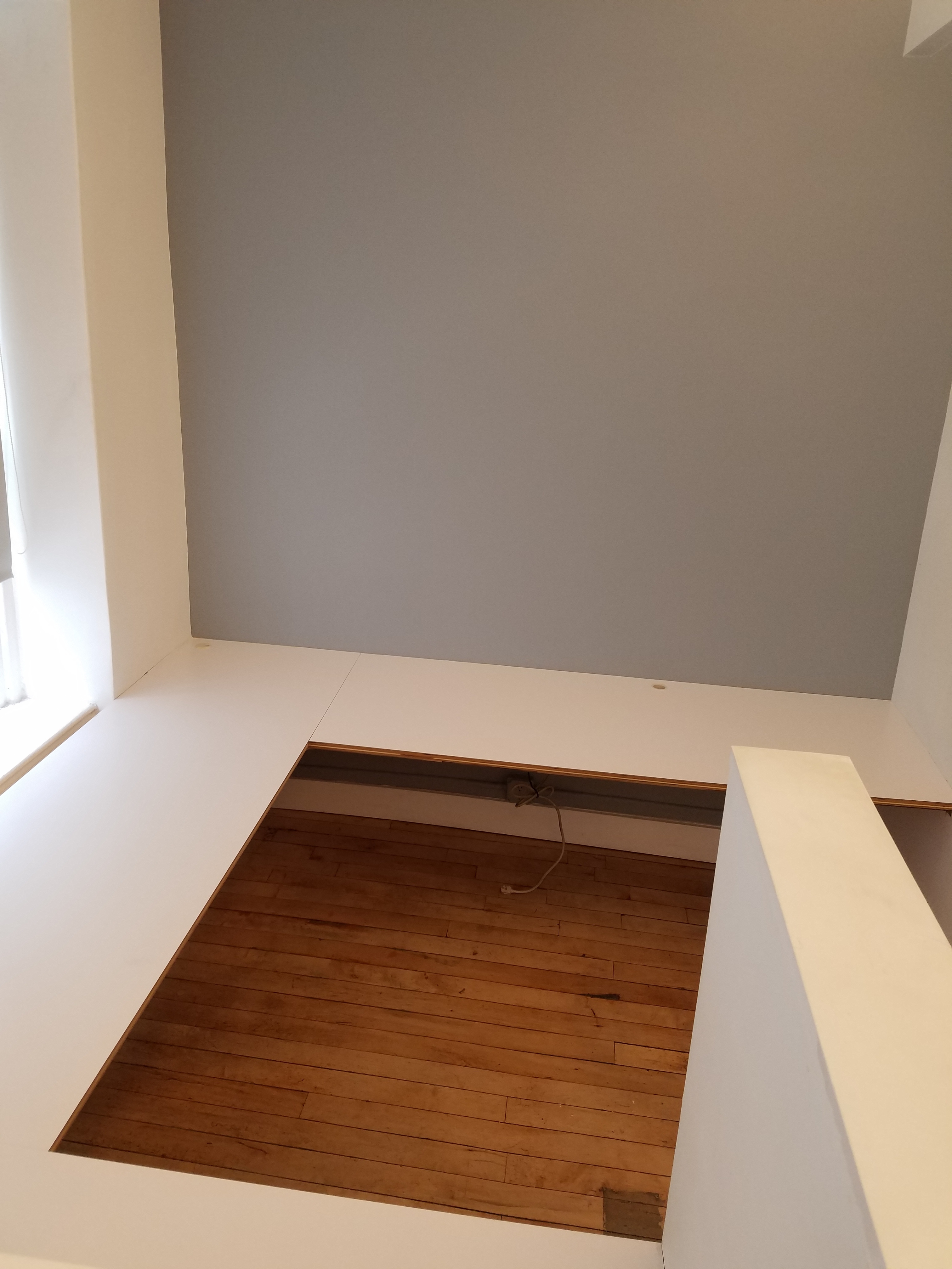 Semi-private corner workspace in quiet creative office