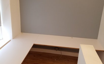 Semi-private corner workspace in quiet creative office