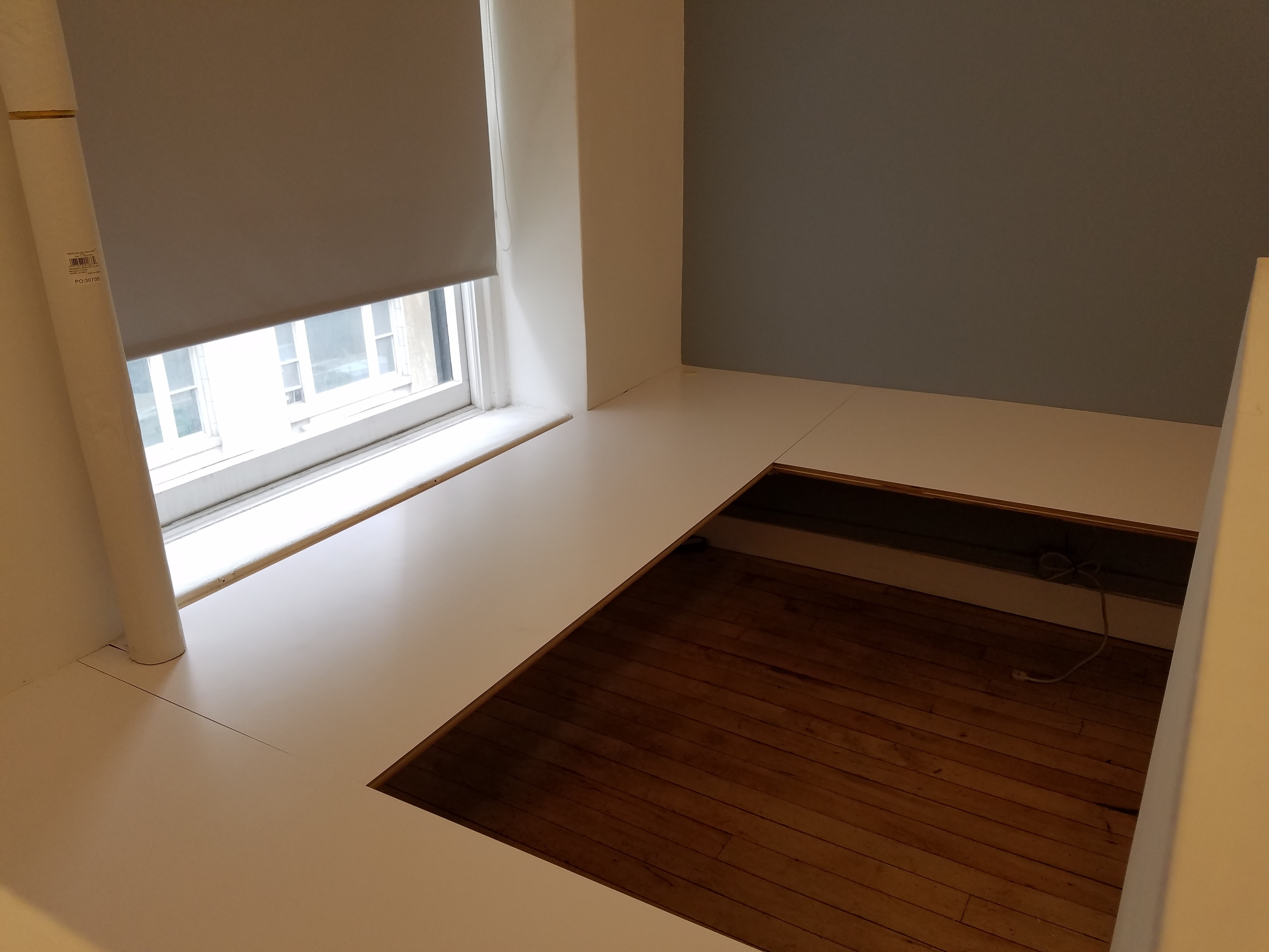 Semi-private corner workspace in quiet creative office