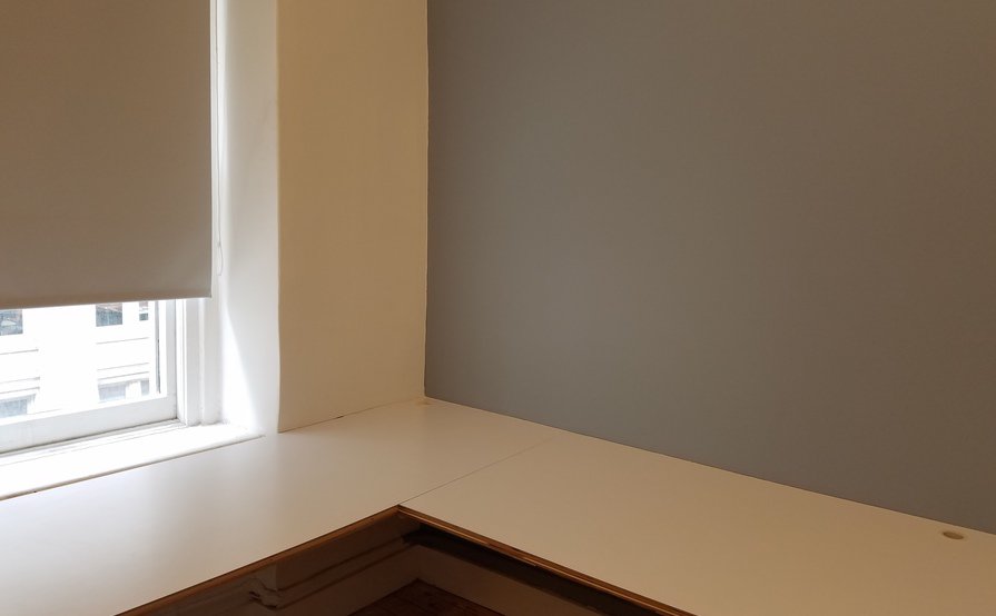 Semi-private corner workspace in quiet creative office Semi-private corner workspace in quiet creative office