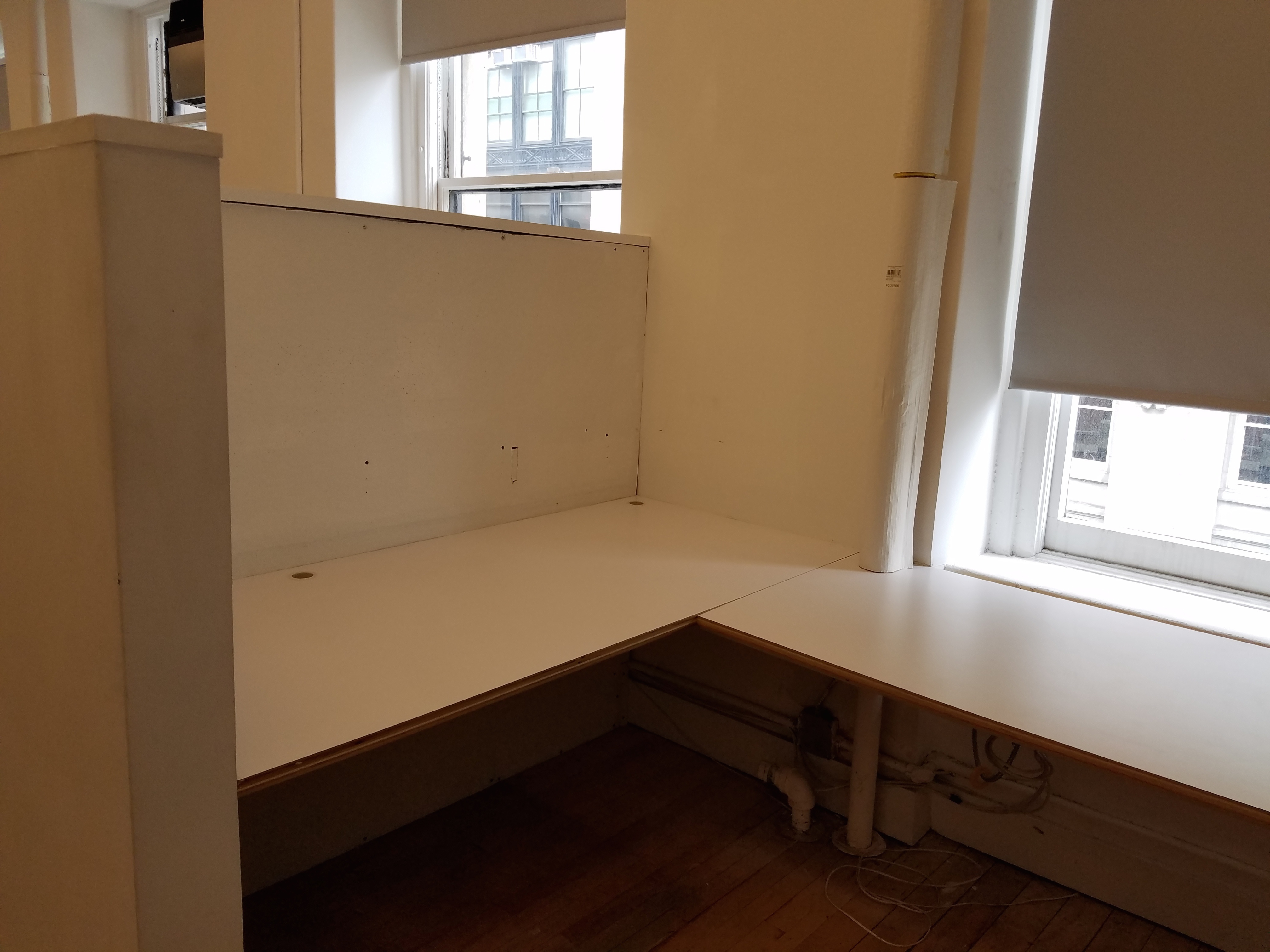 Semi-private corner workspace in quiet creative office