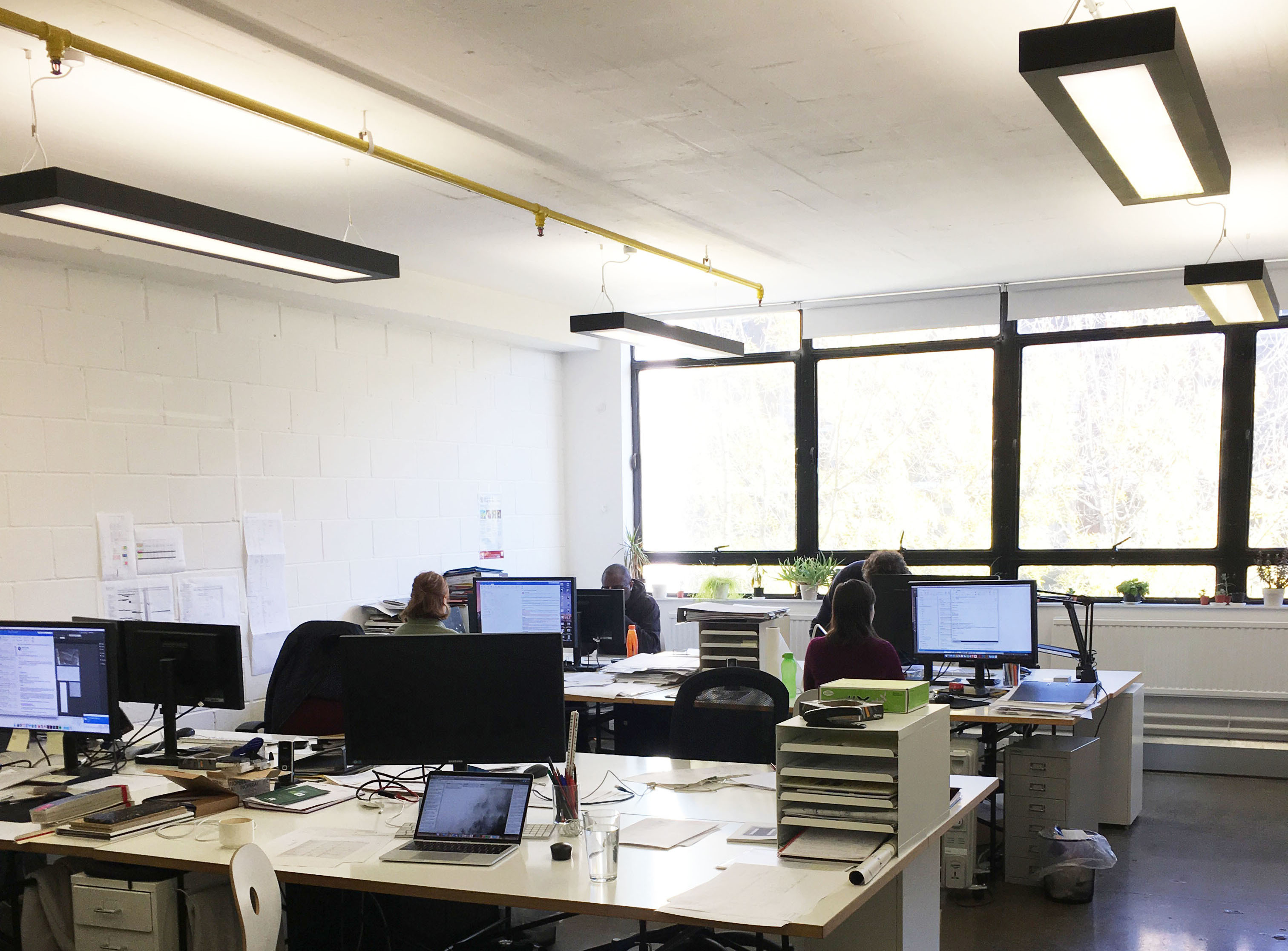 Large desks in bright period building