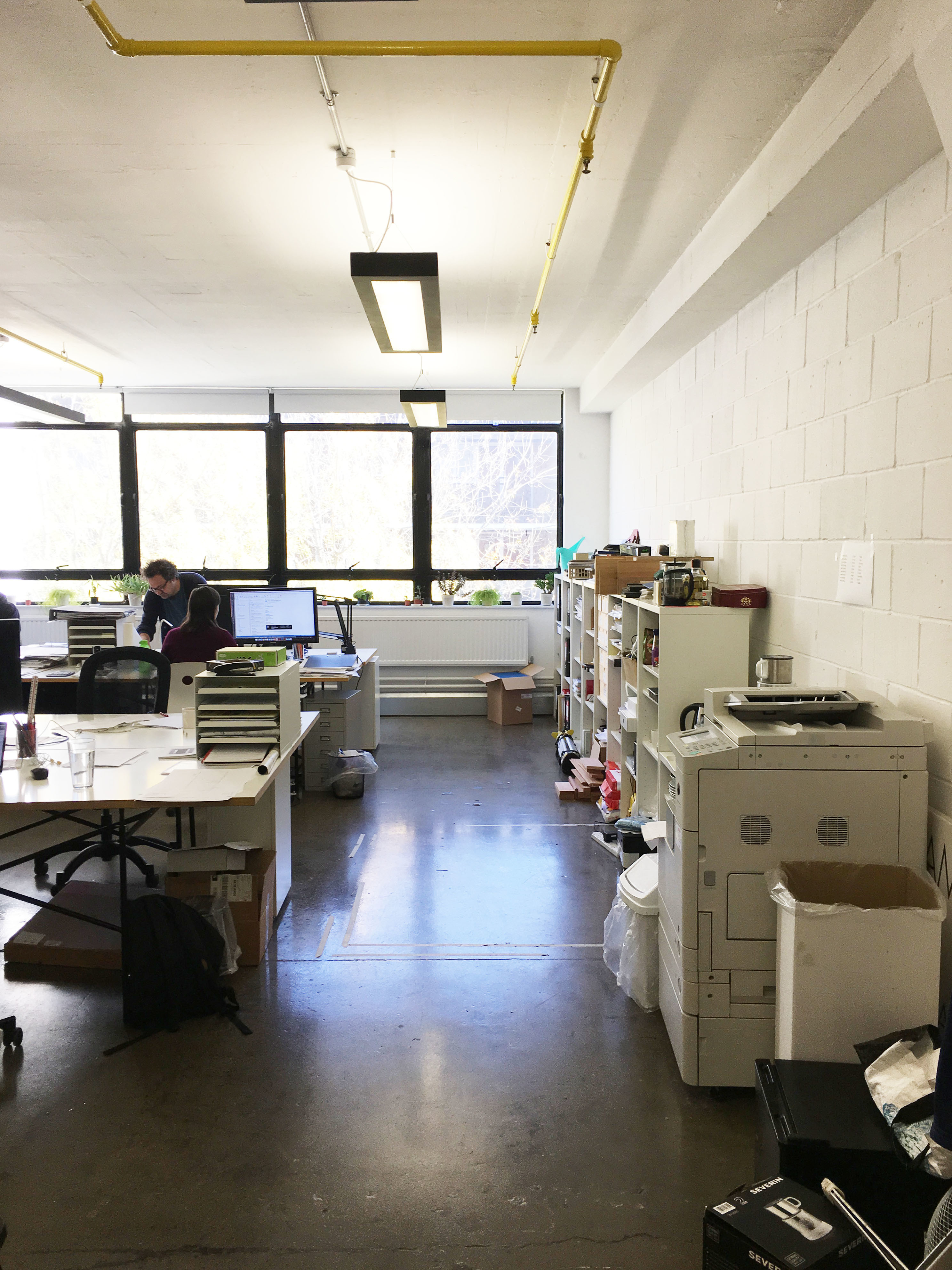 Large desks in bright period building
