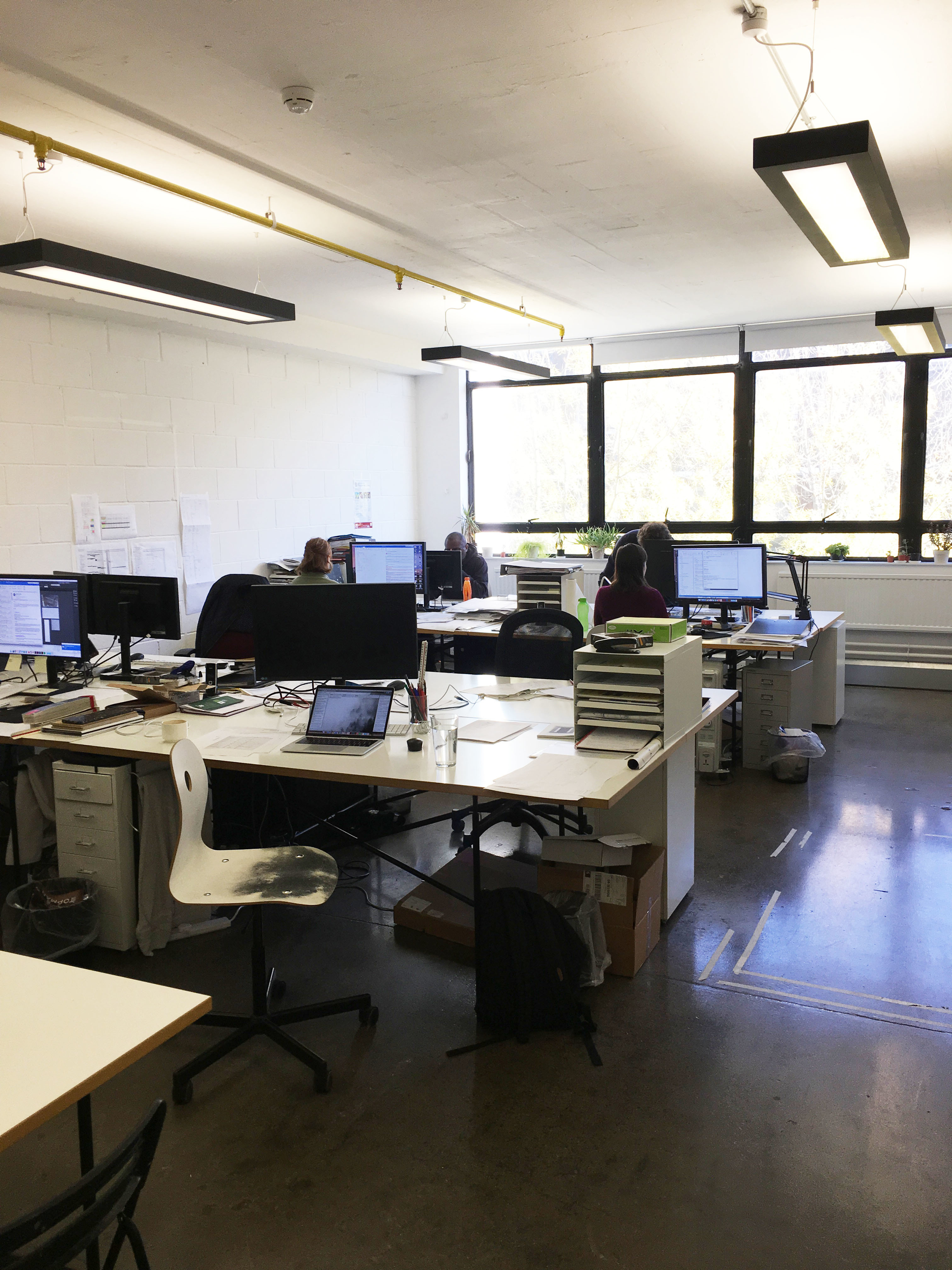 Large desks in bright period building