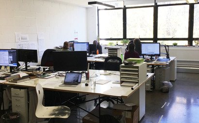 Large desks in bright period building Large desks in bright period building