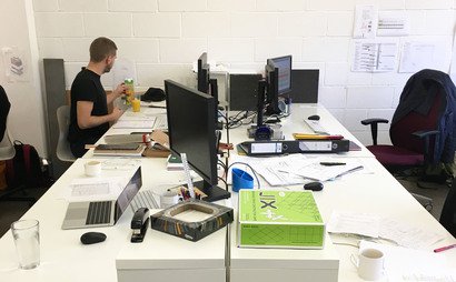Large desks in bright period building Large desks in bright period building
