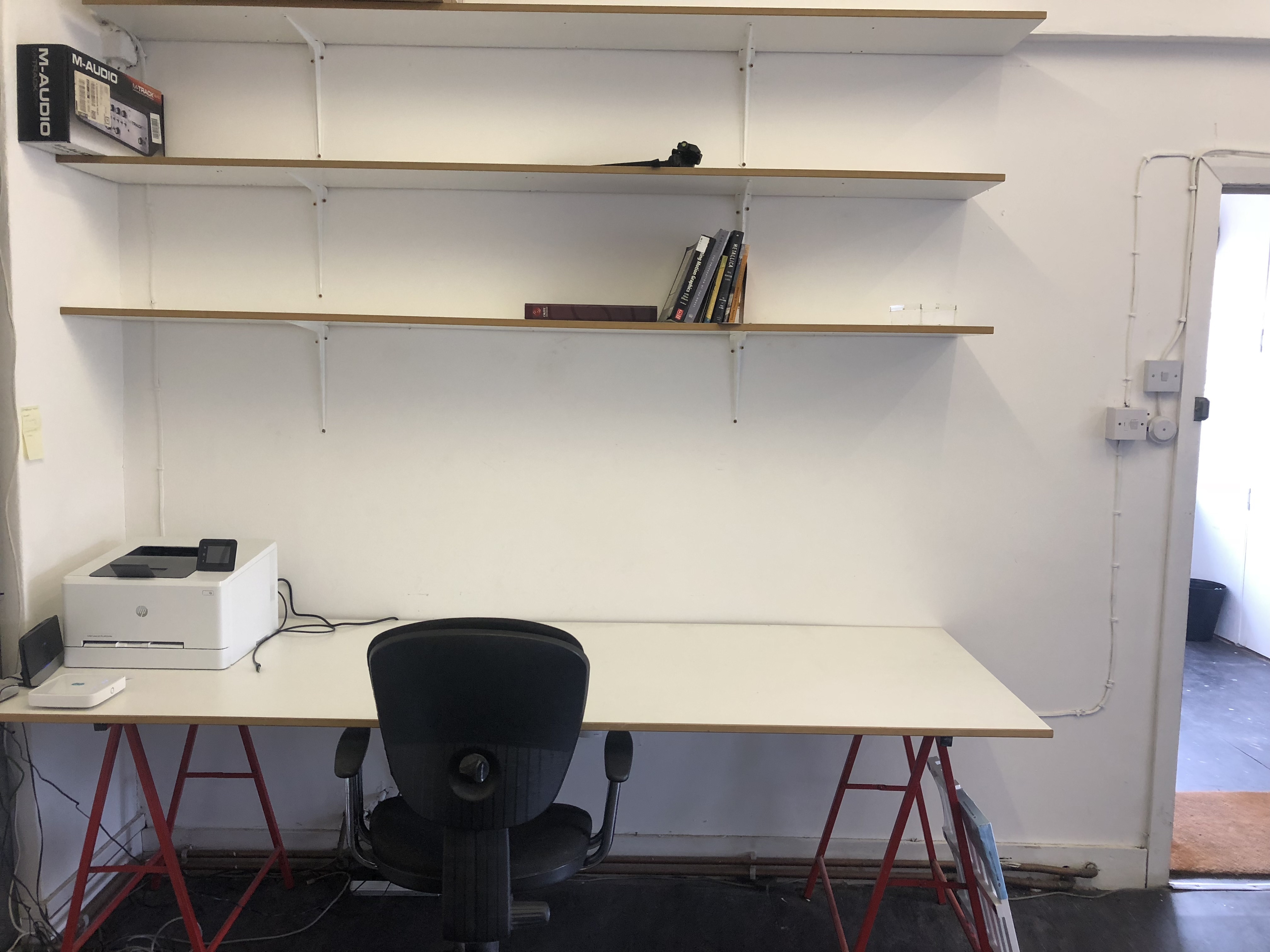 Large desks in a warehose office in Stoke Newington