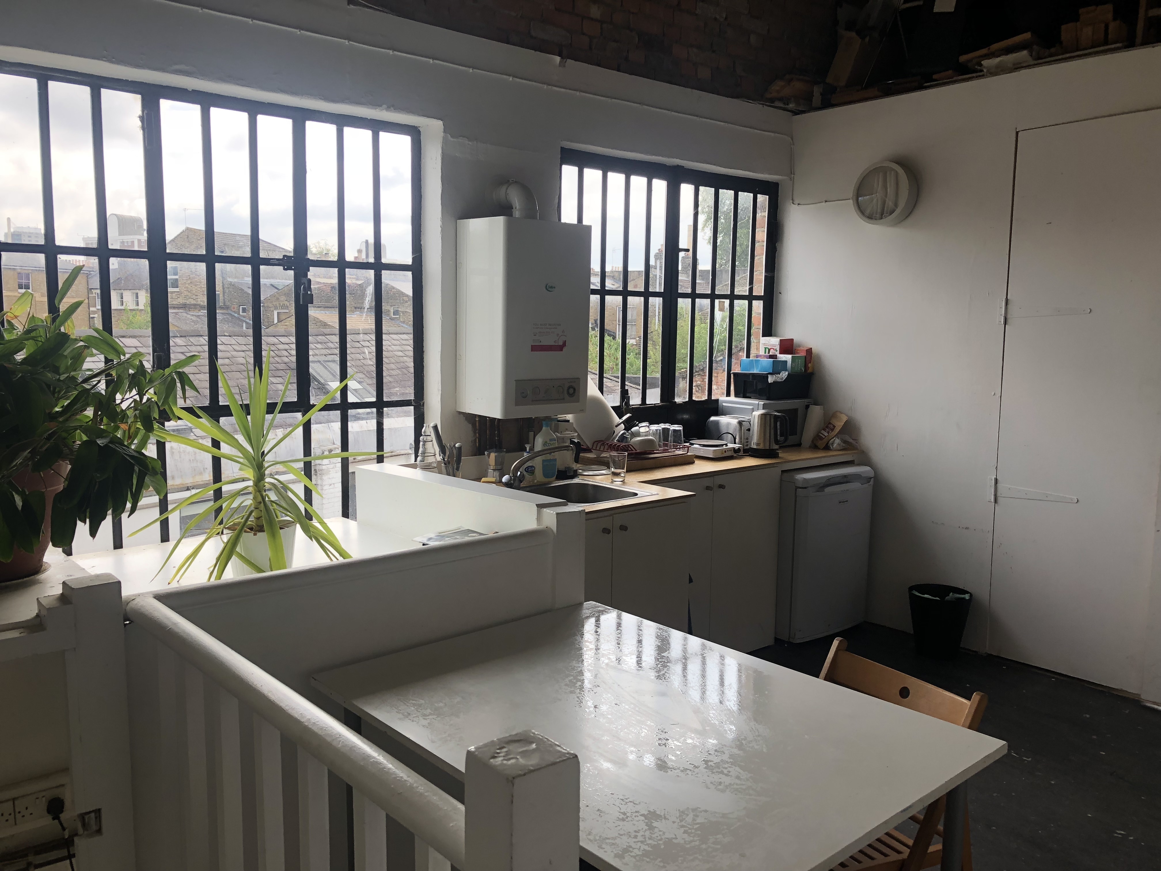 Large desks in a warehose office in Stoke Newington