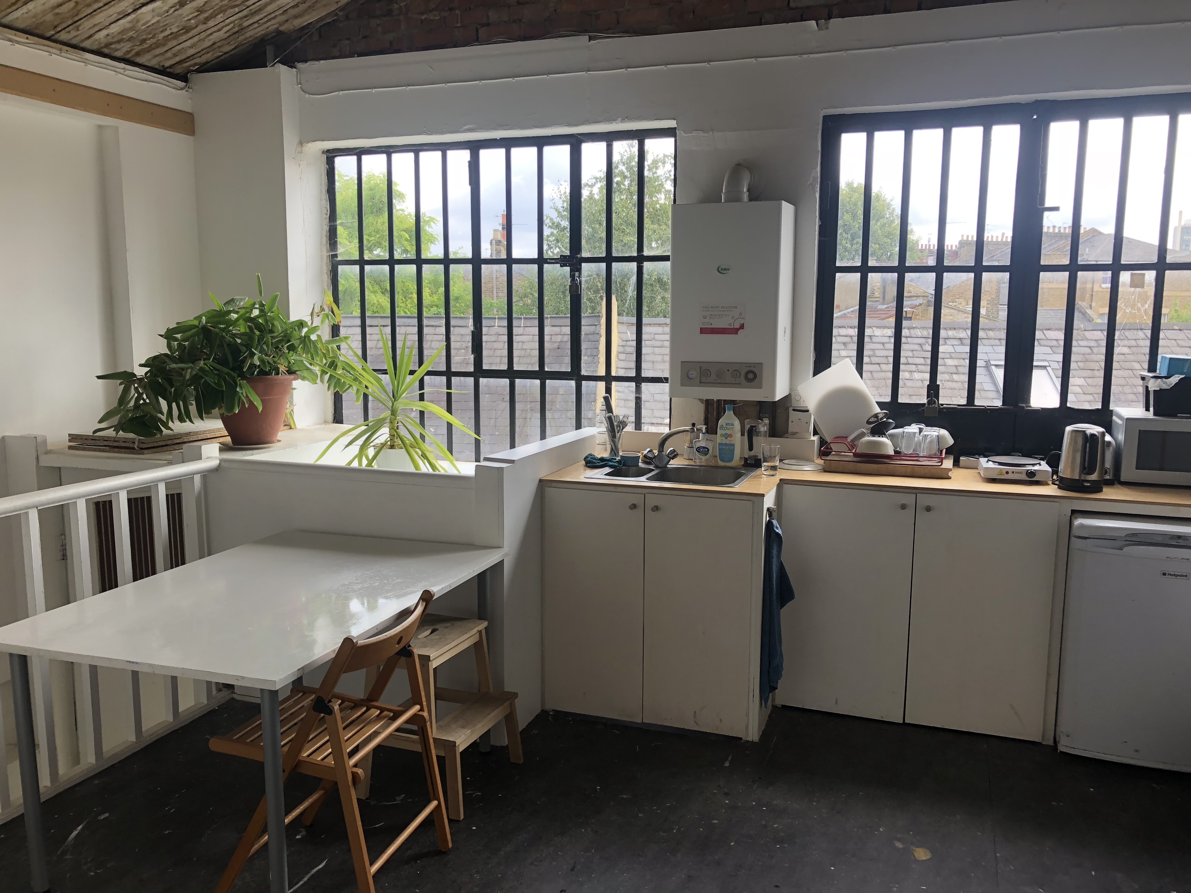 Large desks in a warehose office in Stoke Newington
