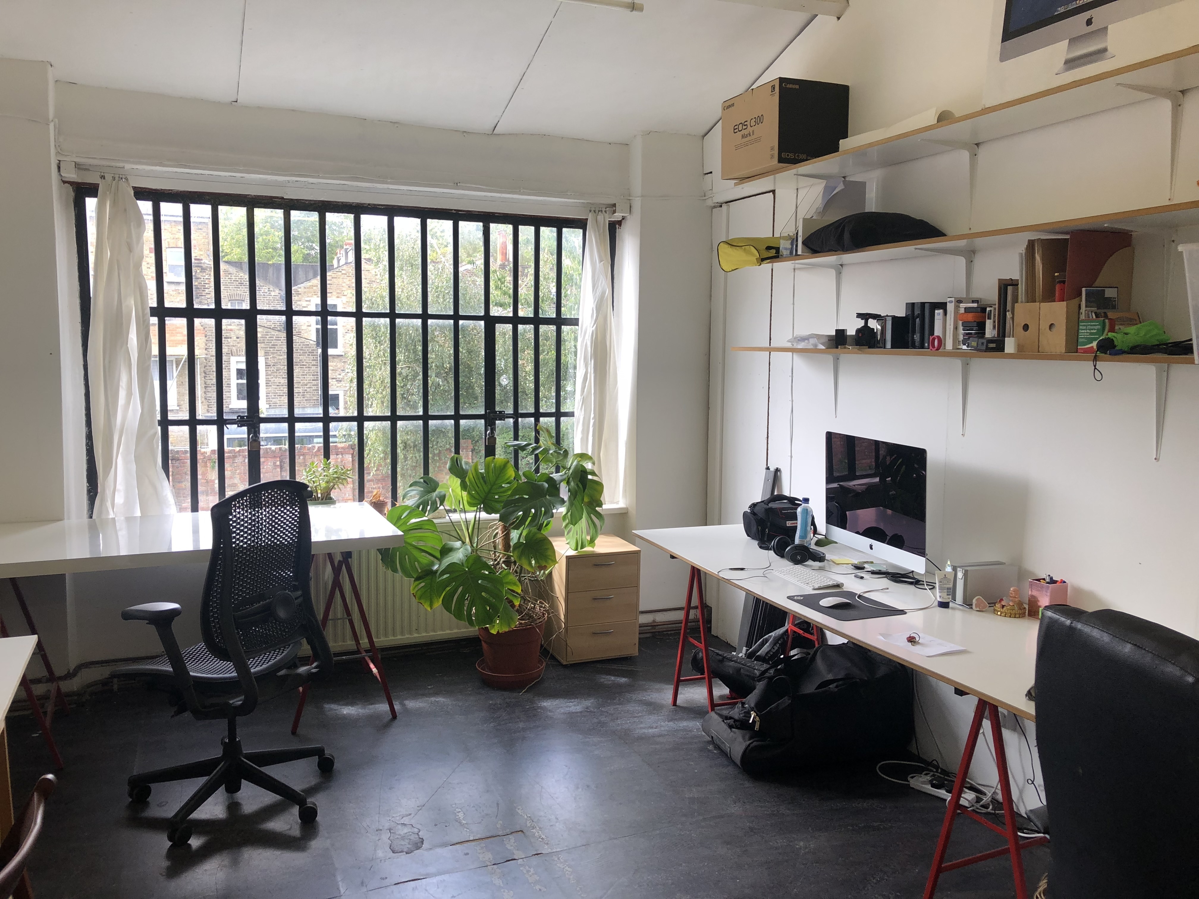 Large desks in a warehose office in Stoke Newington