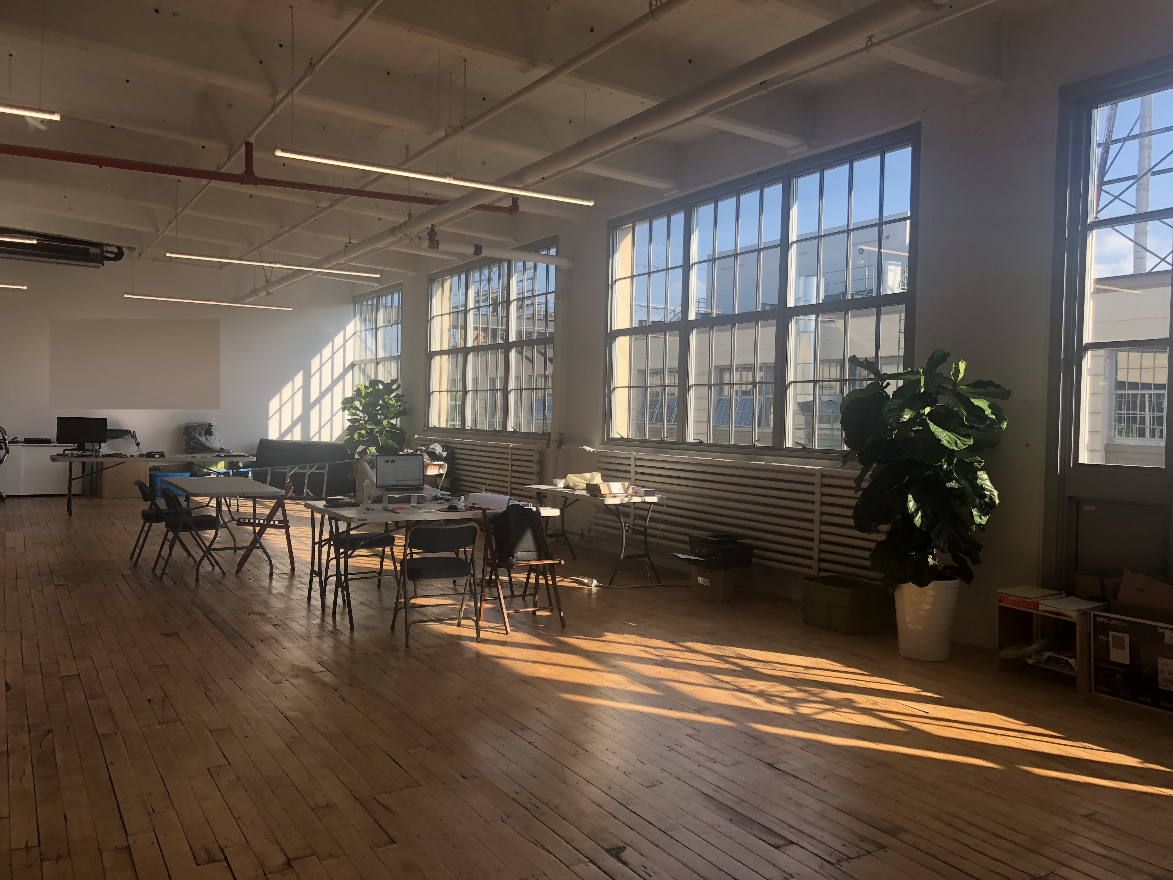 Set up your desk in big, bright, modern office Set up your desk in big, bright, modern office