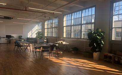 Set up your desk in big, bright, modern office Set up your desk in big, bright, modern office