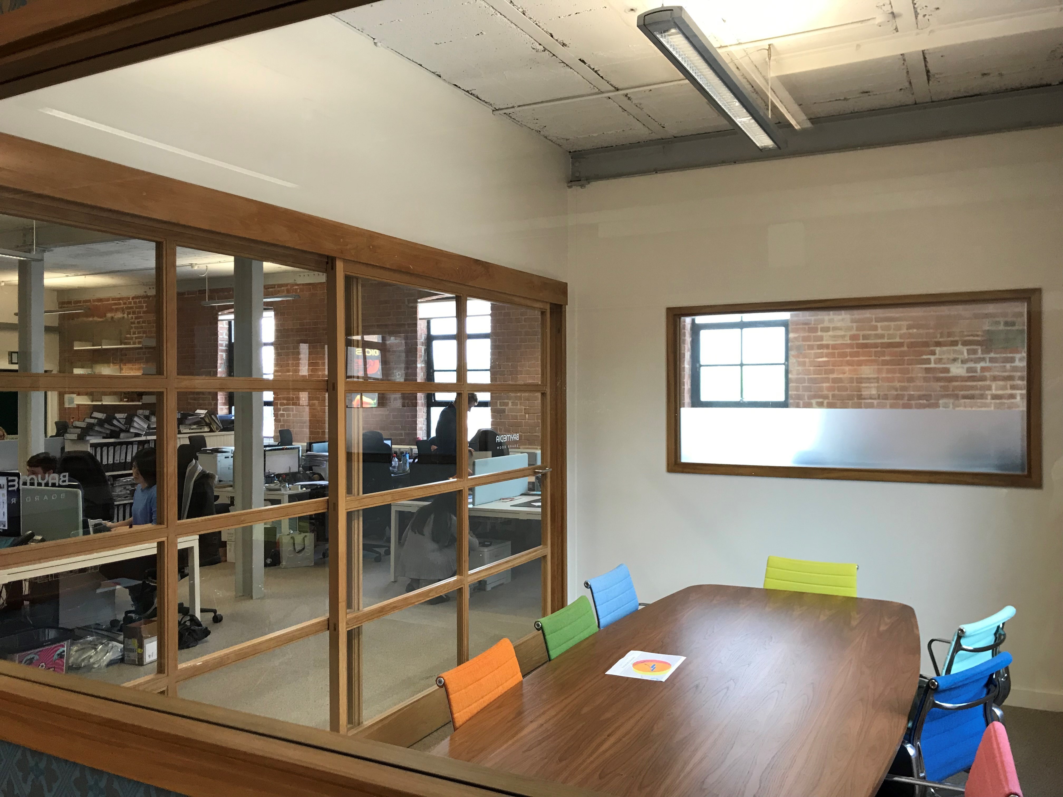 DESKS IN LIGHT AIRY TOP FLOOR WITH HIGH CEILINGS AND LARGE WINDOWS DESKS IN LIGHT AIRY TOP FLOOR WITH HIGH CEILINGS AND LARGE WINDOWS