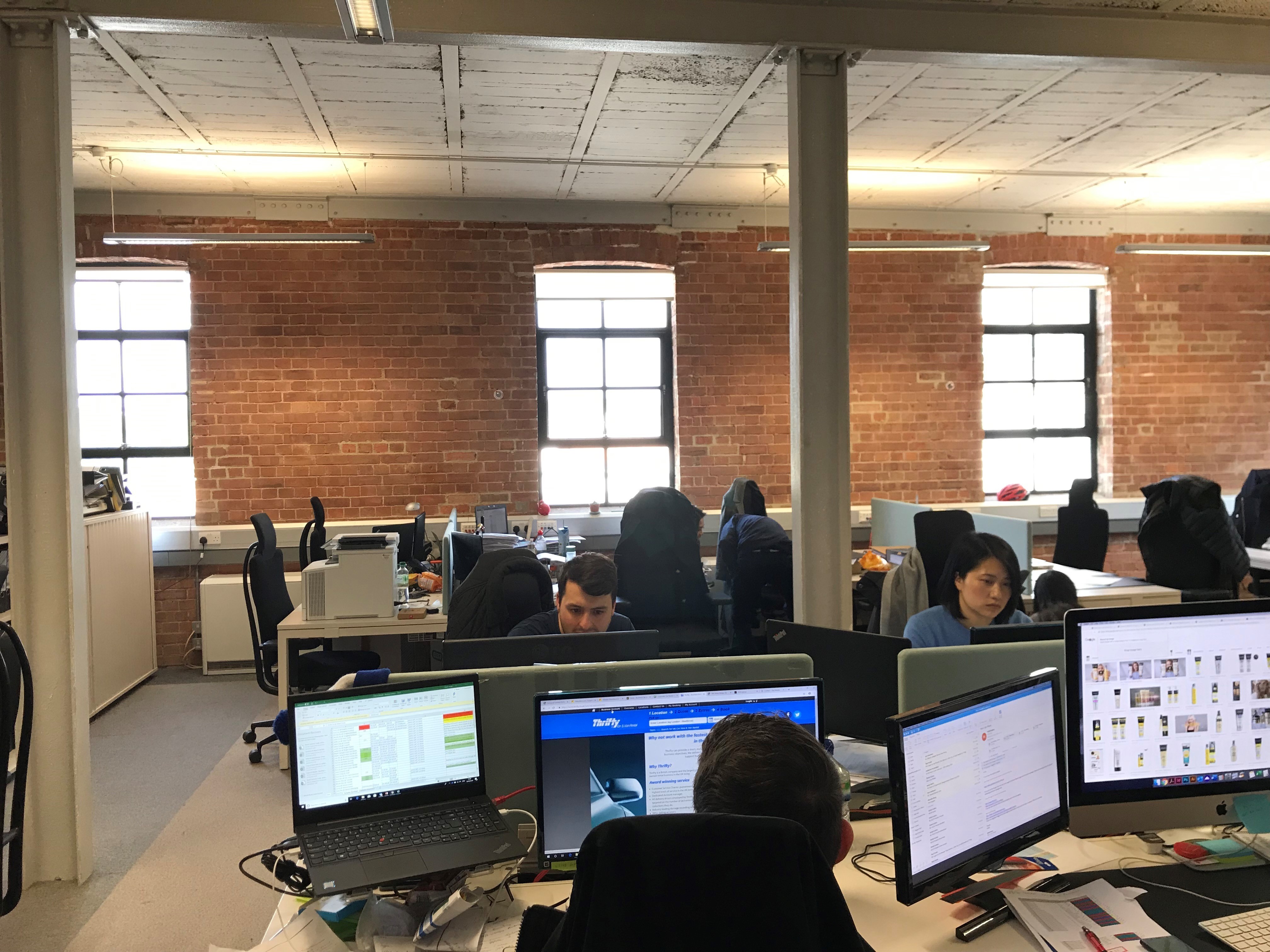 DESKS IN LIGHT AIRY TOP FLOOR WITH HIGH CEILINGS AND LARGE WINDOWS DESKS IN LIGHT AIRY TOP FLOOR WITH HIGH CEILINGS AND LARGE WINDOWS