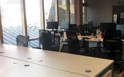 Flexible desk options in energetic office Flexible desk options in energetic office